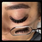 Close-up of eyelash extensions with magnifying glass